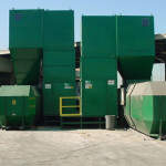 Side by side food waste compactors feeding 40-yard receiver containers.
