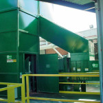 Loading door to dump basket with safety handrails.